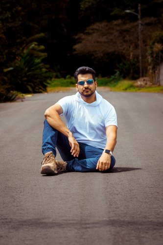 Azar seated outdoors near Arenal, Alajuela