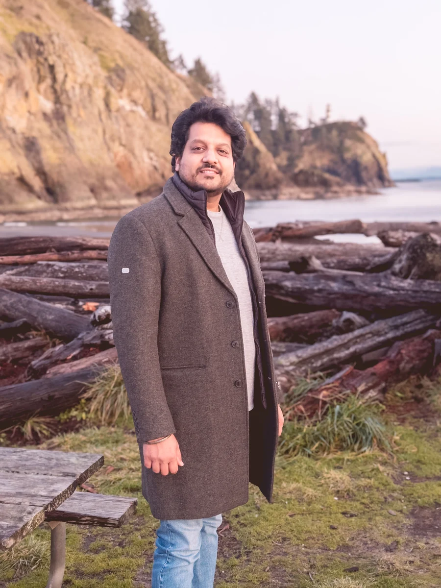 Azar beside the coast in a brown coat, Cape Disappointment, Washington