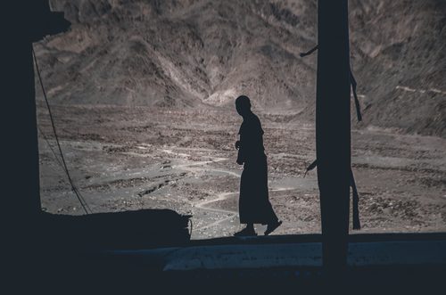 Monk in silhouette, Leh, India