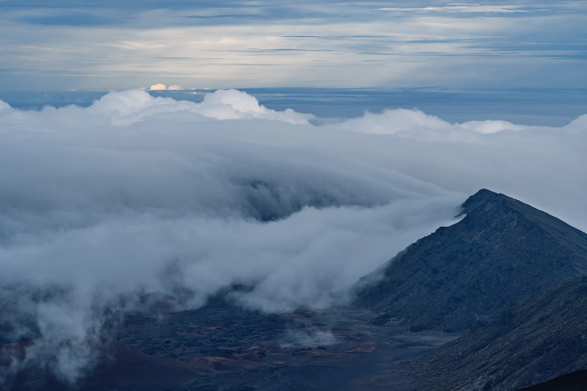 Clouds spilling into the volcanic crater, Haleakala, Hawaii