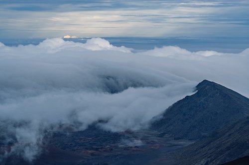 Clouds spilling into the volcanic crater, Haleakala, Hawaii