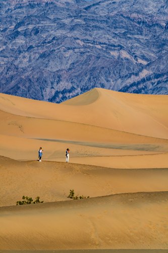 Two figures among the dunes, Death Valley National Park, California