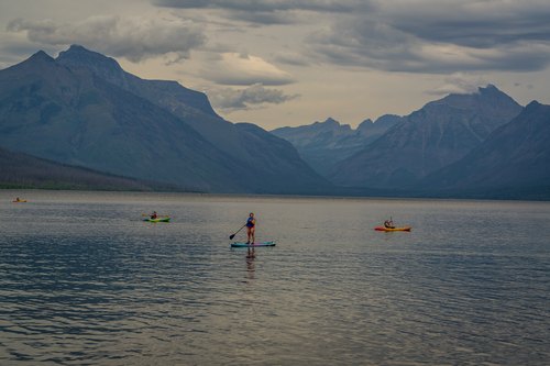 Paddleboarder on the mountain lake, Glacier National Park, Montana