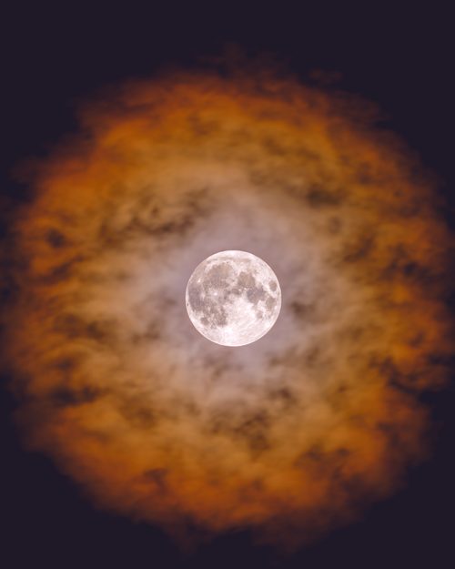 Blue Supermoon through clouds, Kent, Washington
