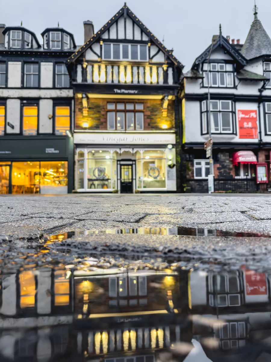Warm shopfront on a rainy evening, Bowness-on-Windermere, England