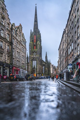 Church spire above the wet street, Edinburgh, Scotland