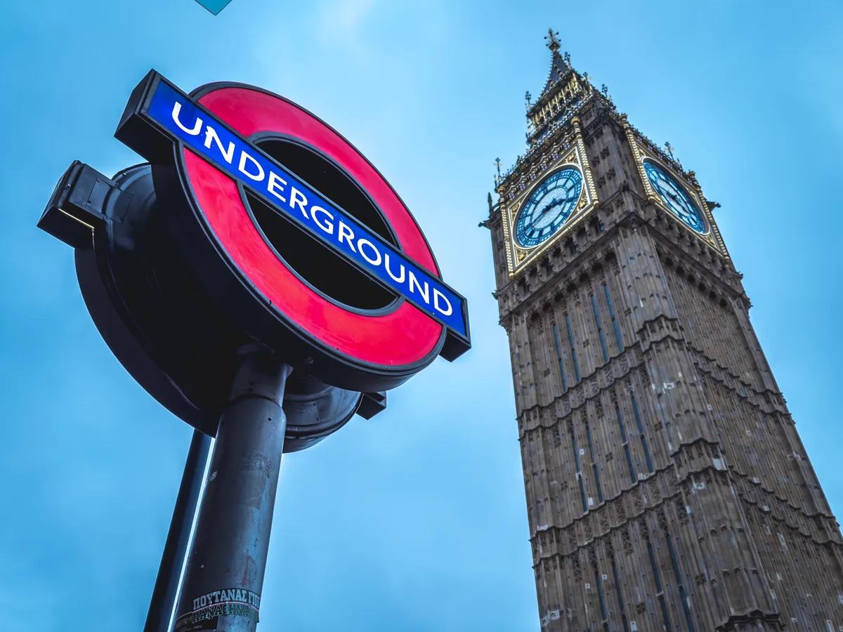 Underground sign beneath the clock tower, City of Westminster, England