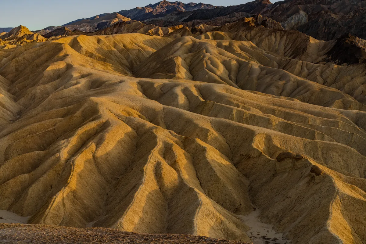 Golden light on desert ridges, Death Valley, California